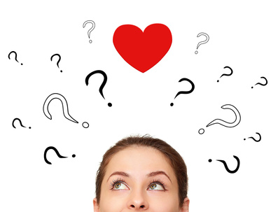 Girl thinking about love with many questions and heart above